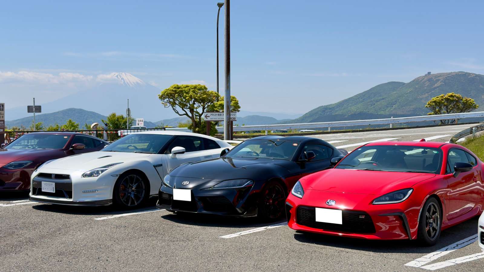 Japanese sports cars with Mount Fuji in the distance