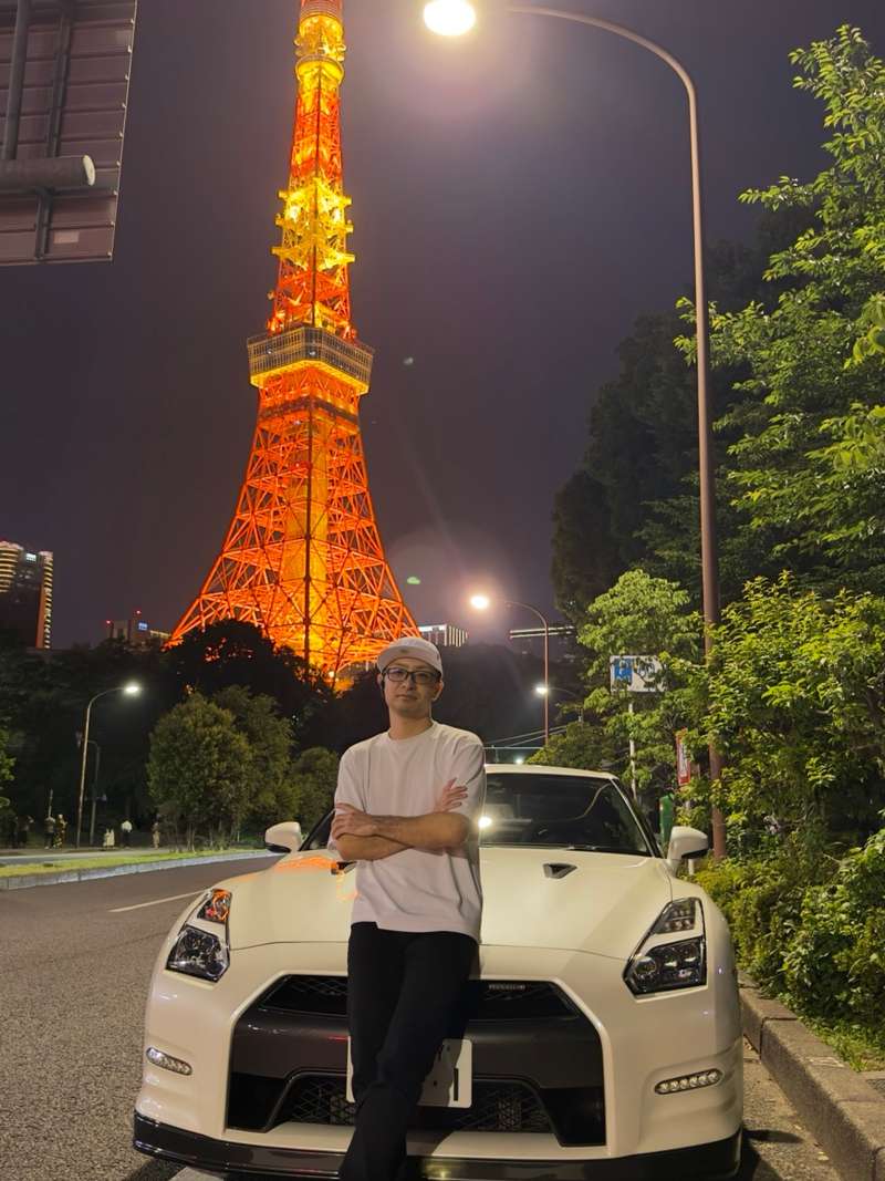 Tokyo Tower at night with the ITADAKI host and the GT-R